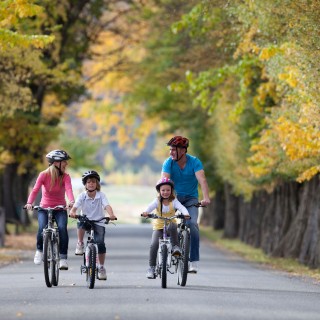 Family biking in autumn